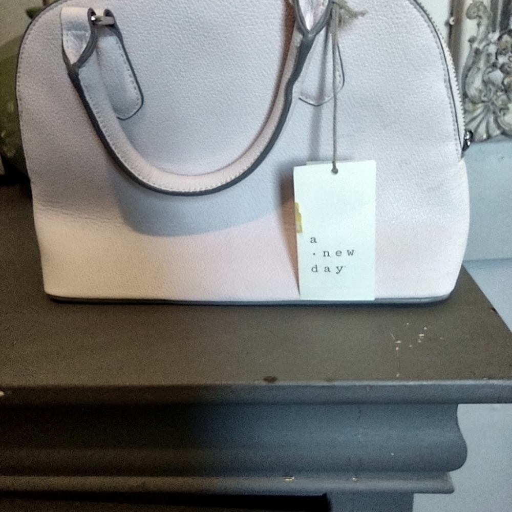 A new day light pink purse